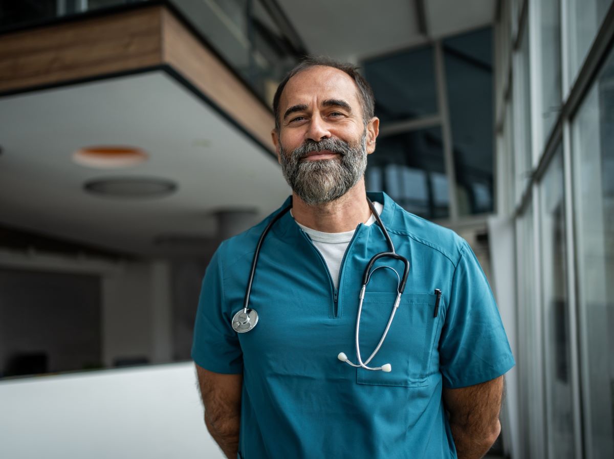 Doctor looking at a camera smiling
